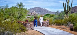 Visitors walk through Desert Arroyo Park