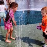 Children enjoy water jets at Friendship Park splash pad