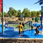 Kids play at the Surprise Farms Park splash pad
